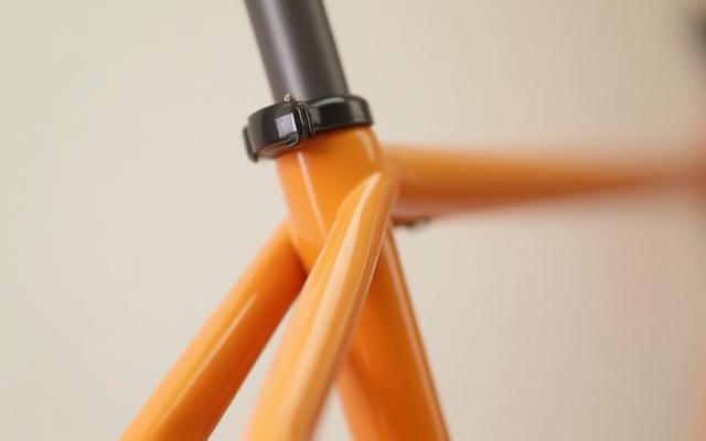 Close-up of a road bike seat stay junction, showing finely brazed connections.